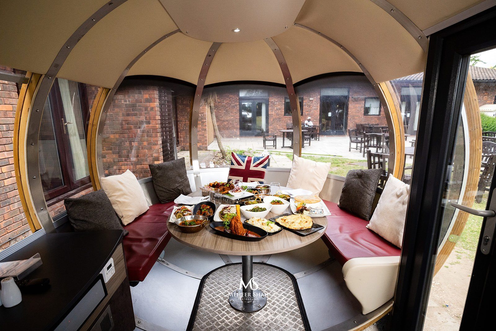Private dining pod with food at Denham Grove